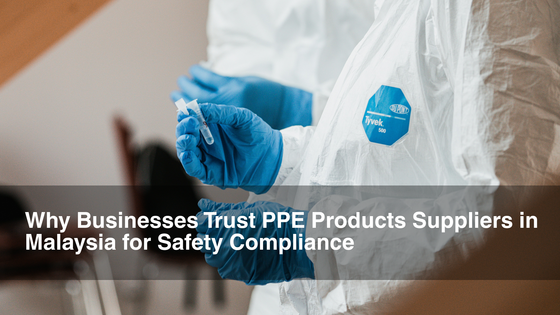 Two lab professionals in PPE equipment